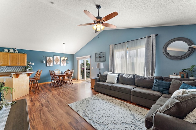 1106 Maplewood Ave SW, Isanti, MN 55040 - living room with lofted ceiling, ceiling fan, a chandelier, wood finished floors, and a textured ceiling