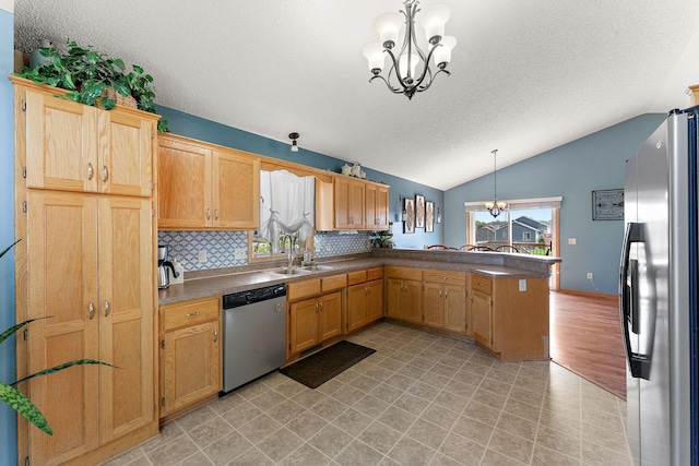 1106 Maplewood Ave SW, Isanti, MN 55040 - kitchen featuring stainless steel appliances, a chandelier, a peninsula, a textured ceiling, and lofted ceiling