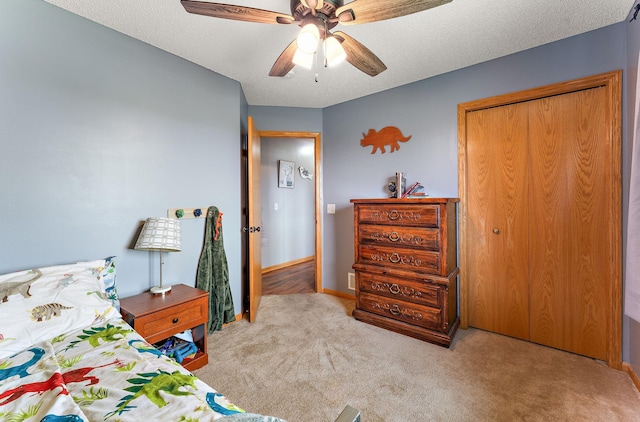 1106 Maplewood Ave SW, Isanti, MN 55040 - bedroom featuring carpet floors, a closet, a ceiling fan, and a textured ceiling