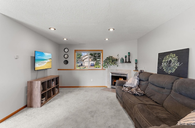1106 Maplewood Ave SW, Isanti, MN 55040 - living area featuring carpet, recessed lighting, a tile fireplace, and a textured ceiling