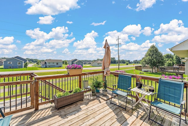 1106 Maplewood Ave SW, Isanti, MN 55040 - deck featuring a residential view and a lawn