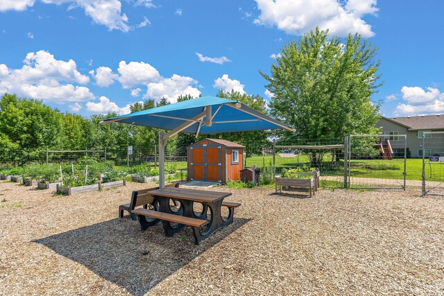 1106 Maplewood Ave SW, Isanti, MN 55040 - view of community with a garden and a storage shed