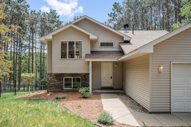 17813 224th Ave NW, Big Lake, MN 55309 - view of front of house with roof with shingles, brick siding, and a garage