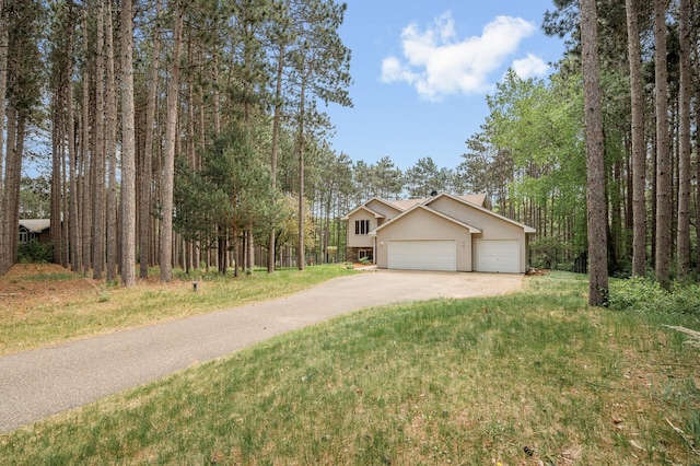 17813 224th Ave NW, Big Lake, MN 55309 - view of front of house featuring asphalt driveway, a garage, and a front lawn