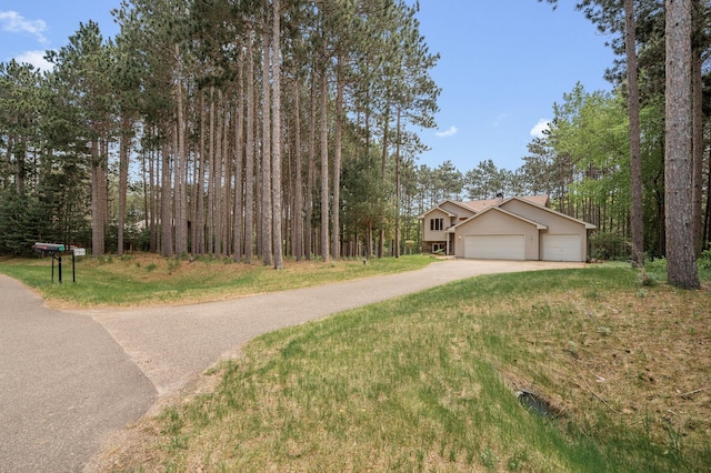 17813 224th Ave NW, Big Lake, MN 55309 - view of front of property with concrete driveway, an attached garage, and a front yard