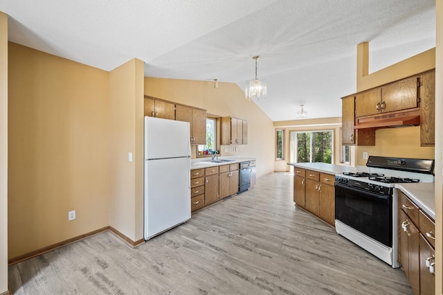 17813 224th Ave NW, Big Lake, MN 55309 - kitchen featuring freestanding refrigerator, range with gas stovetop, under cabinet range hood, dishwasher, and light countertops