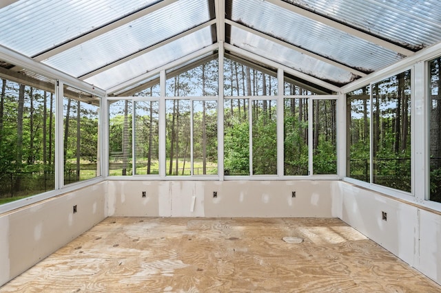 17813 224th Ave NW, Big Lake, MN 55309 - unfurnished sunroom featuring vaulted ceiling and view of scattered trees