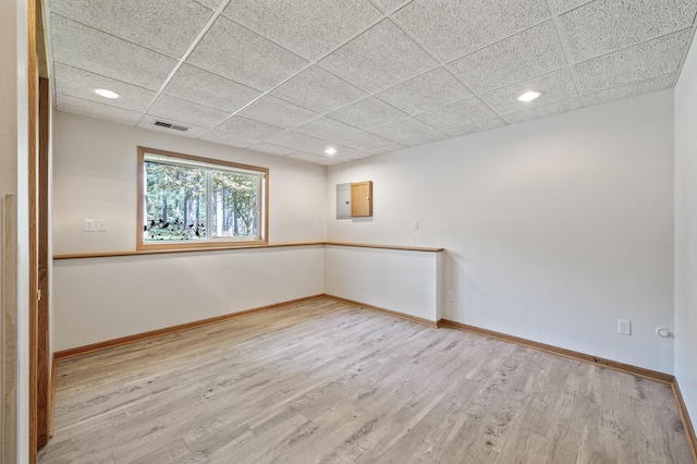 17813 224th Ave NW, Big Lake, MN 55309 - spare room with light wood-style flooring, recessed lighting, baseboards, and a paneled ceiling
