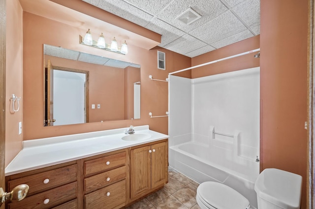 17813 224th Ave NW, Big Lake, MN 55309 - bathroom featuring toilet, vanity, washtub / shower combination, tile patterned flooring, and a drop ceiling