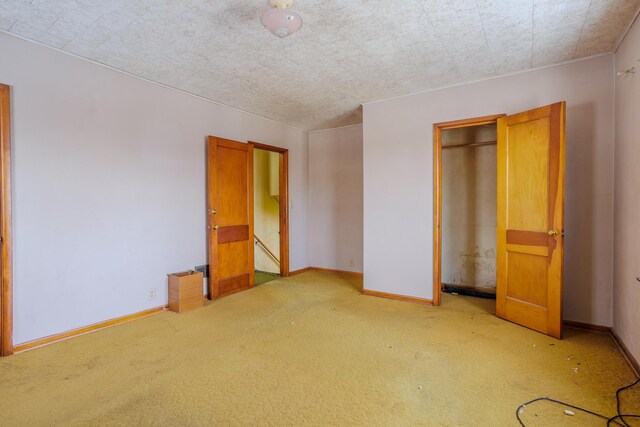 123 Thomas Hill Rd, Jackson, MN 56143 - unfurnished bedroom featuring baseboards, a closet, and carpet