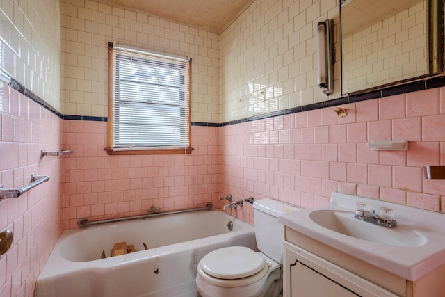 123 Thomas Hill Rd, Jackson, MN 56143 - full bathroom featuring tile walls, toilet, vanity, and a tub