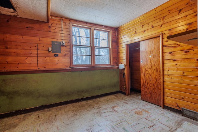 123 Thomas Hill Rd, Jackson, MN 56143 - spare room featuring wooden walls and visible vents