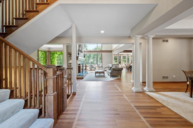 4325 Trillium Ln W, Minnetrista, MN 55364 - staircase with ornate columns, wood finished floors, and recessed lighting