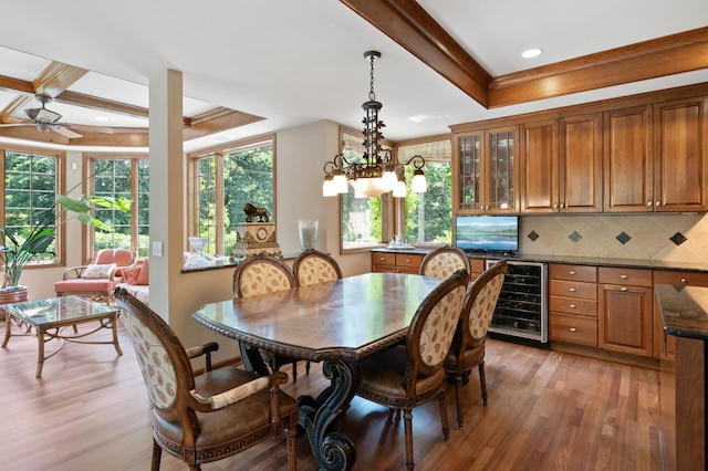 4325 Trillium Ln W, Minnetrista, MN 55364 - dining space featuring beverage cooler, light wood-type flooring, a raised ceiling, ceiling fan, and recessed lighting
