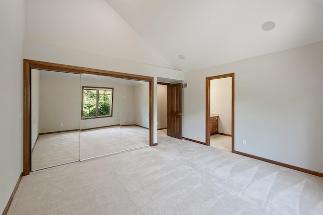 4325 Trillium Ln W, Minnetrista, MN 55364 - unfurnished bedroom featuring high vaulted ceiling, light colored carpet, a closet, and ensuite bathroom