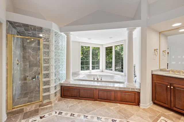 4325 Trillium Ln W, Minnetrista, MN 55364 - bathroom with decorative columns, a shower stall, a garden tub, vanity, and vaulted ceiling