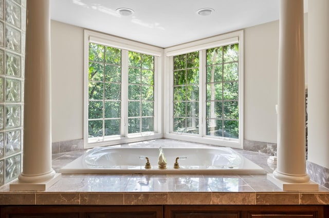 4325 Trillium Ln W, Minnetrista, MN 55364 - full bathroom featuring plenty of natural light, a bath, and decorative columns