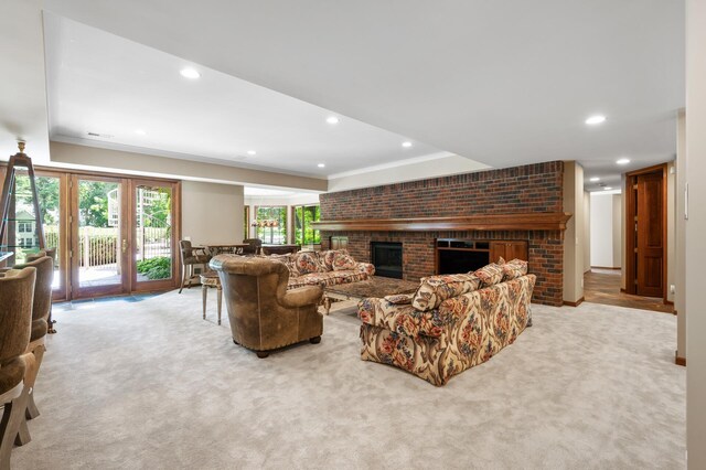 4325 Trillium Ln W, Minnetrista, MN 55364 - living area featuring a fireplace, light carpet, crown molding, and recessed lighting