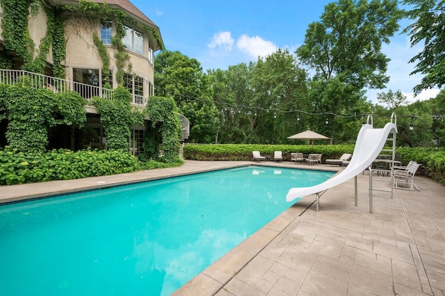 4325 Trillium Ln W, Minnetrista, MN 55364 - outdoor pool with a water slide and a patio area