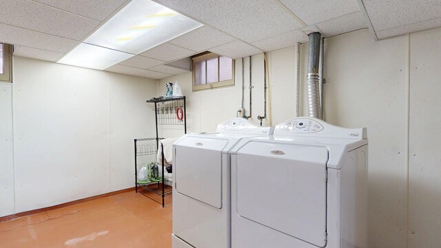 clothes washing area with laundry area and washer and dryer