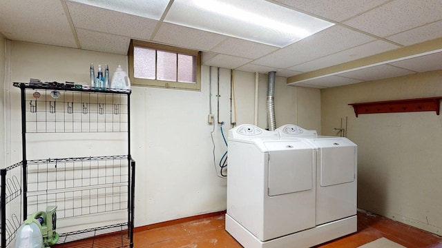 washroom with laundry area and washing machine and dryer