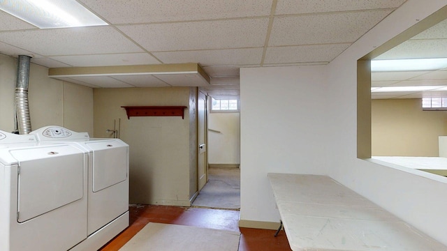 laundry room with plenty of natural light, laundry area, wood finished floors, and washer and clothes dryer