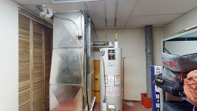 utility room with water heater