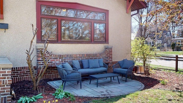 view of patio / terrace with fence and an outdoor living space