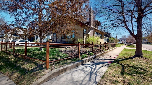 surrounding community featuring fence and a residential view