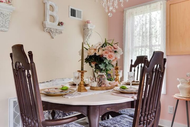 2085 Queens Ave S, Lakeland, MN 55043 - dining space with visible vents and a chandelier