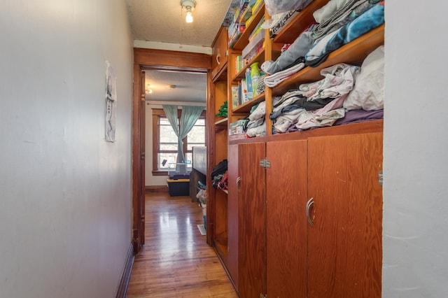 1311 Irving St, Alexandria, MN 56308 - hall featuring baseboards and wood finished floors