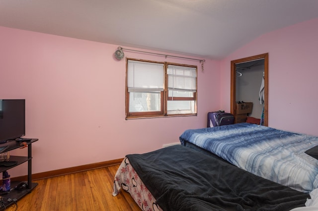 1311 Irving St, Alexandria, MN 56308 - bedroom featuring vaulted ceiling, light wood finished floors, and baseboards
