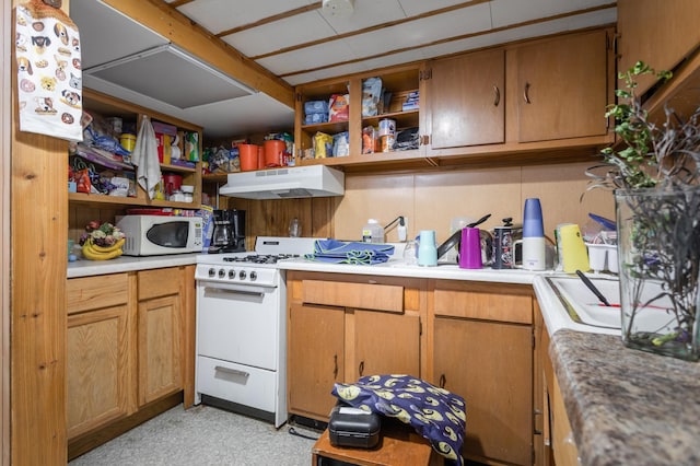1311 Irving St, Alexandria, MN 56308 - kitchen featuring white appliances, under cabinet range hood, open shelves, and light countertops