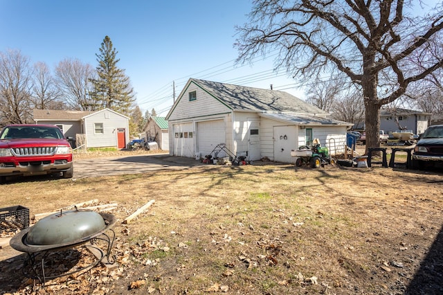 1311 Irving St, Alexandria, MN 56308 - view of yard with a detached garage and an outdoor structure