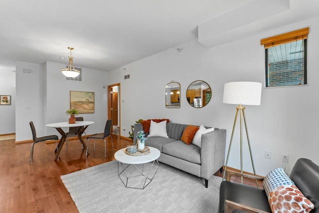 2565 Franklin Ave Unit 109, Saint Paul, MN 55114 - living room featuring wood finished floors and baseboards