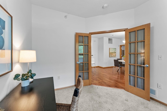 2565 Franklin Ave Unit 109, Saint Paul, MN 55114 - office area with french doors, carpet, and baseboards