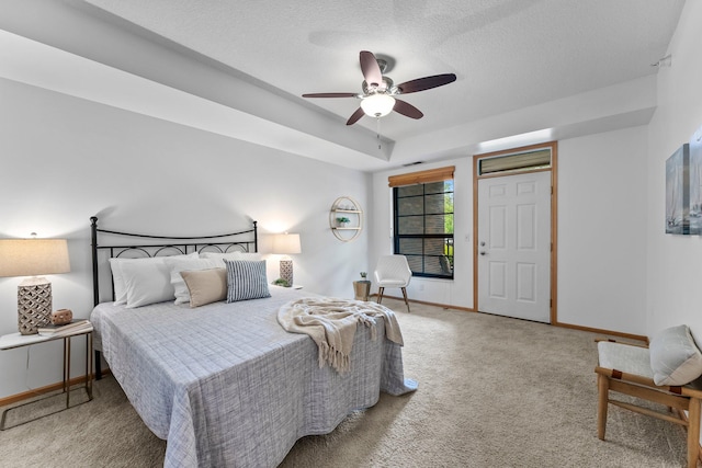 2565 Franklin Ave Unit 109, Saint Paul, MN 55114 - bedroom with carpet floors, baseboards, a textured ceiling, and ceiling fan
