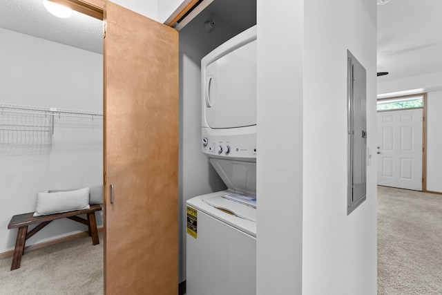 2565 Franklin Ave Unit 109, Saint Paul, MN 55114 - washroom with stacked washing machine and dryer, light carpet, and baseboards
