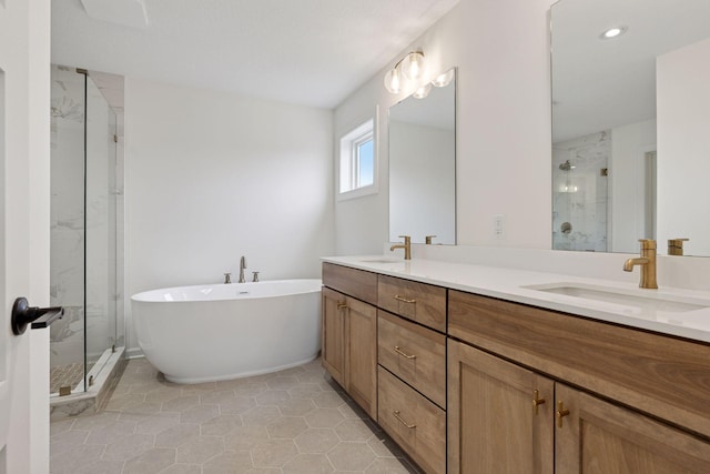 6200 Harkness Alcove S, Cottage Grove, MN 55016 - bathroom featuring a marble finish shower, double vanity, a freestanding bath, tile patterned flooring, and recessed lighting