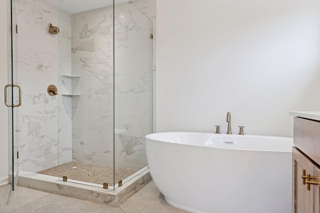 6200 Harkness Alcove S, Cottage Grove, MN 55016 - bathroom featuring a soaking tub, a marble finish shower, vanity, and tile patterned flooring