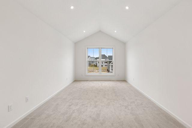 6200 Harkness Alcove S, Cottage Grove, MN 55016 - additional living space featuring light colored carpet, vaulted ceiling, and recessed lighting