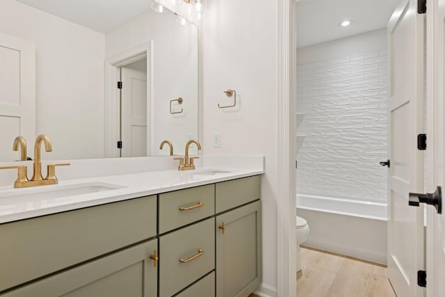 6200 Harkness Alcove S, Cottage Grove, MN 55016 - bathroom with double vanity, shower / washtub combination, wood finished floors, and recessed lighting