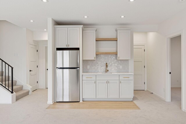 6200 Harkness Alcove S, Cottage Grove, MN 55016 - kitchen with freestanding refrigerator, light carpet, light countertops, recessed lighting, and tasteful backsplash
