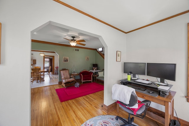1114 6th St, Mankato, MN 56001 - office area with crown molding, arched walkways, wood finished floors, and baseboards