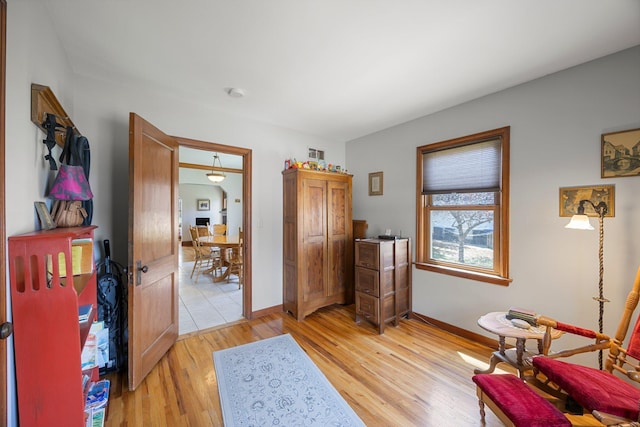 1114 6th St, Mankato, MN 56001 - sitting room featuring baseboards and light wood-style flooring