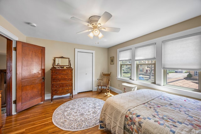1114 6th St, Mankato, MN 56001 - bedroom with wood finished floors, ceiling fan, and baseboards