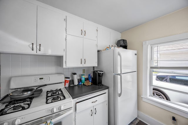 1114 6th St, Mankato, MN 56001 - kitchen featuring white appliances, tasteful backsplash, and white cabinetry