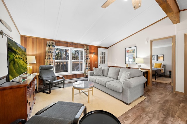 living room featuring wood finished floors, vaulted ceiling with beams, baseboard heating, and wood walls