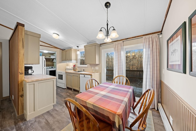 dining space featuring wainscoting, vaulted ceiling, wood finished floors, and a chandelier