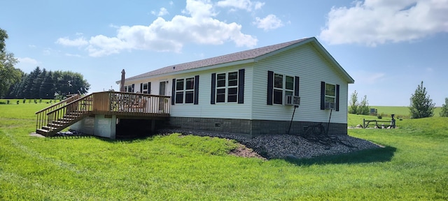 view of side of home featuring cooling unit, a yard, stairway, and a deck